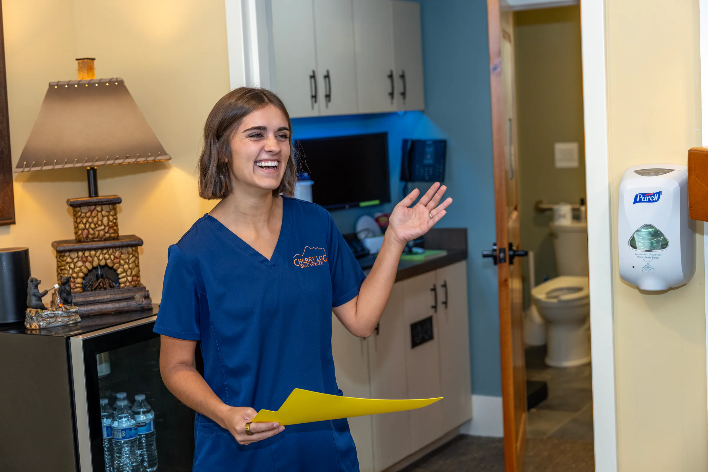 Smiling Cherry Log Oral Surgery team member greeting patients