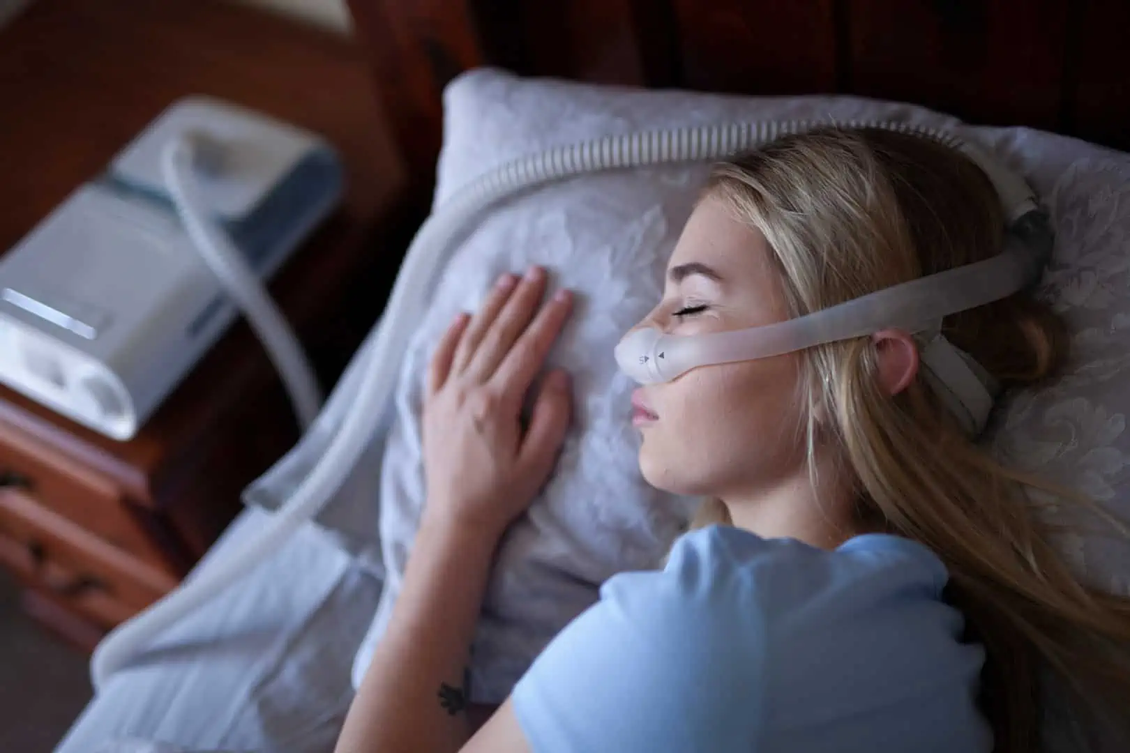 A person resting peacefully after addressing obstructive sleep apnea